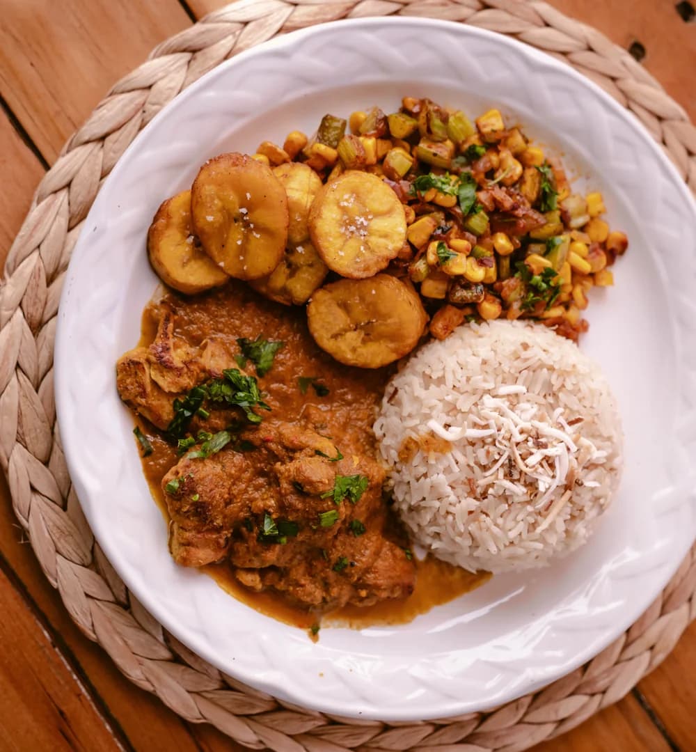 Editorial detail of curry and its sides.