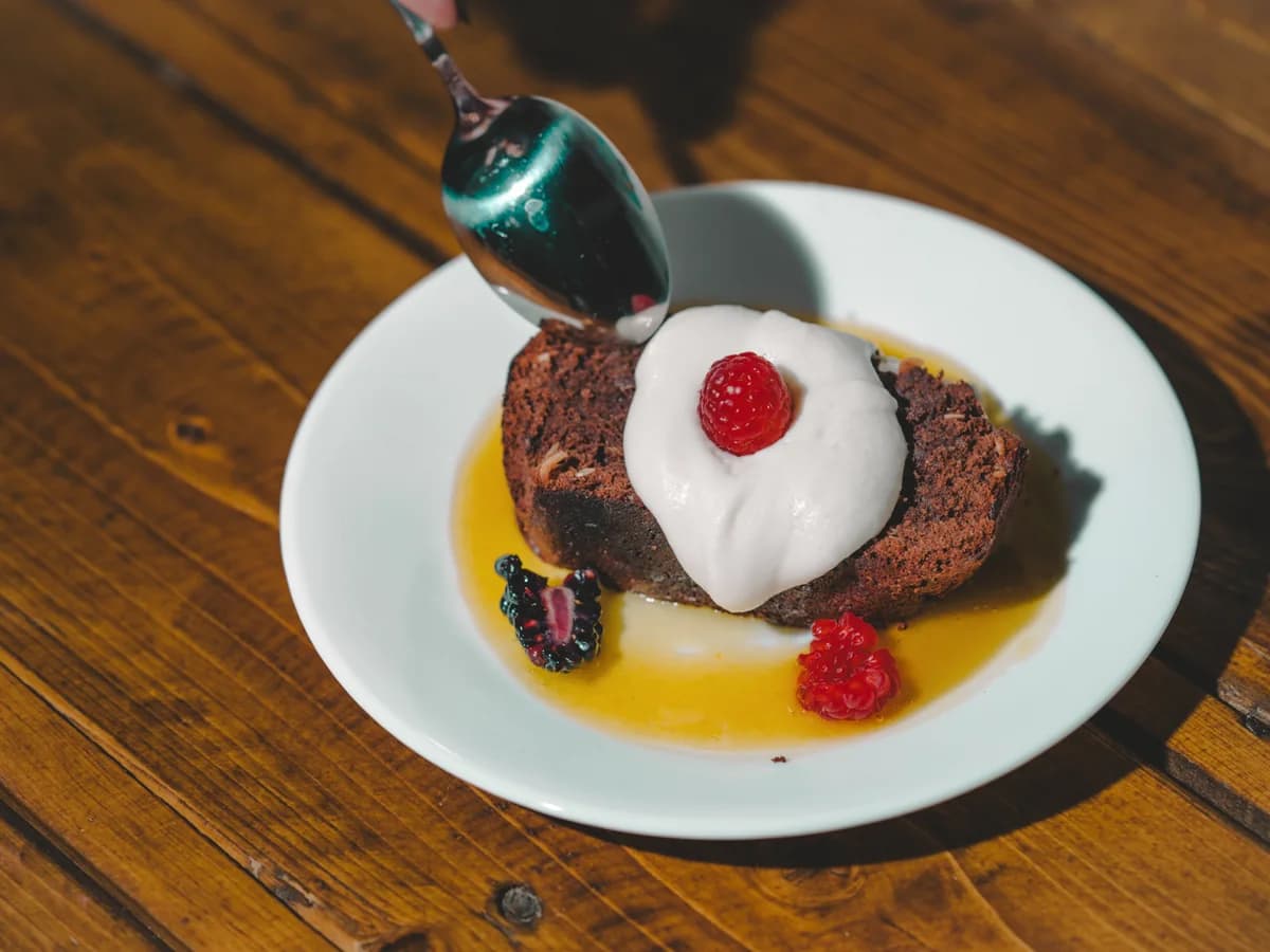 Dessert and tableware on a warm table.